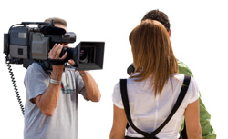 picture of cameraman filming a young couple